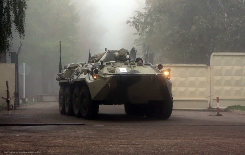 Military armored vehicle in fog