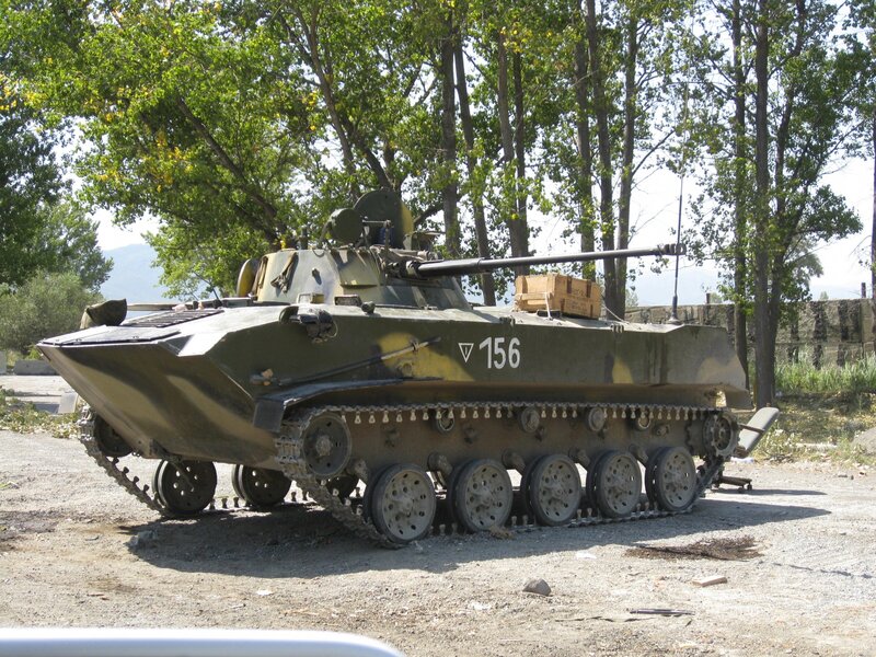 Military armored vehicle in forest