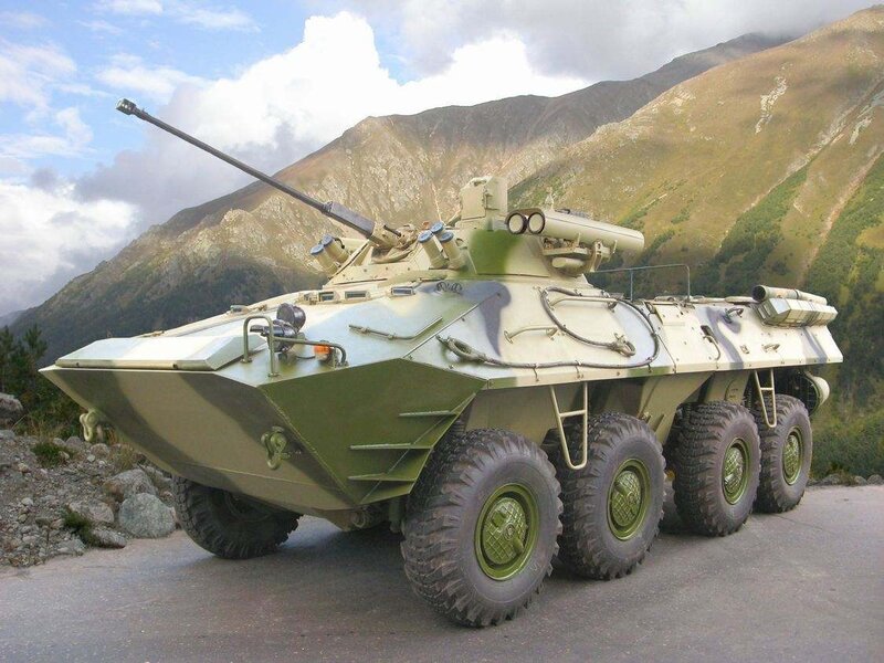 Military armored vehicle in mountains