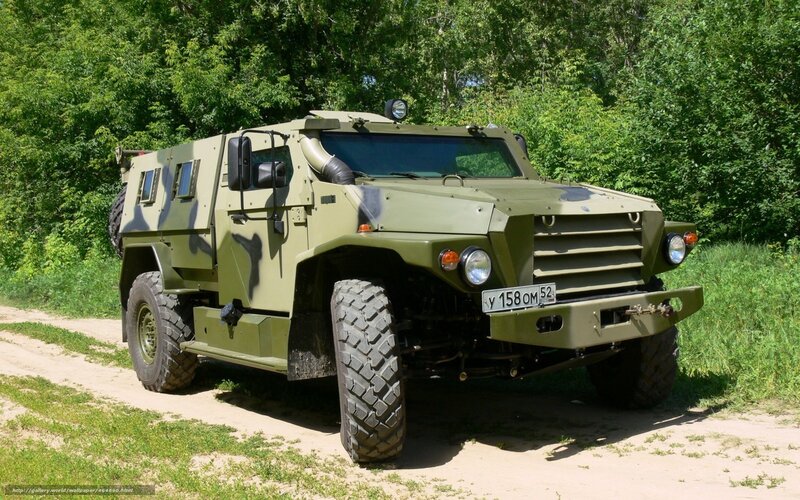 Military armored vehicle on dirt road