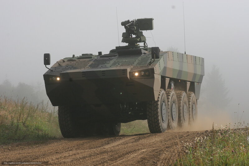 Military armored vehicle on dirt road