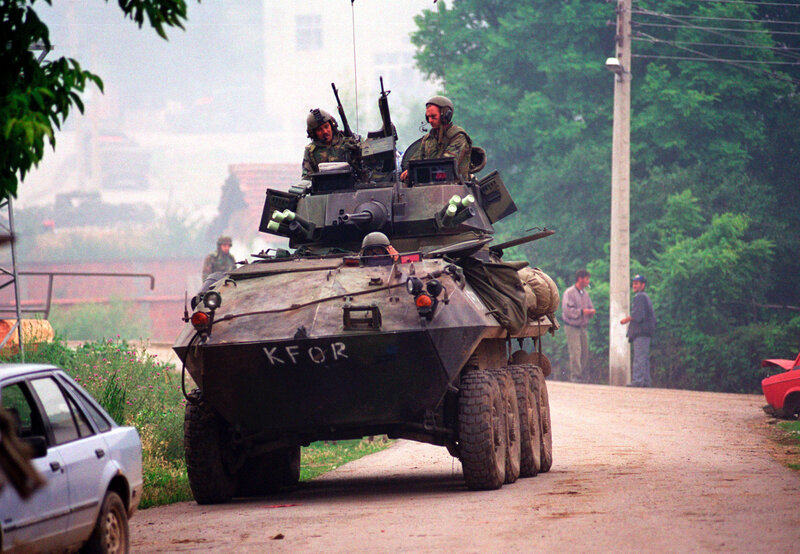 Military armored vehicle on road