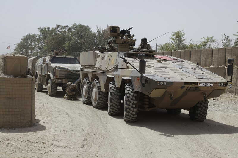 Military armored vehicles in convoy