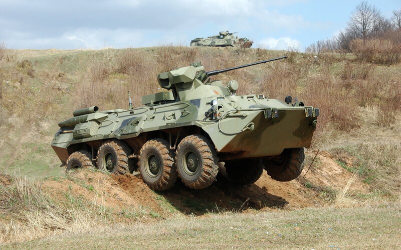 Military armored vehicles on terrain