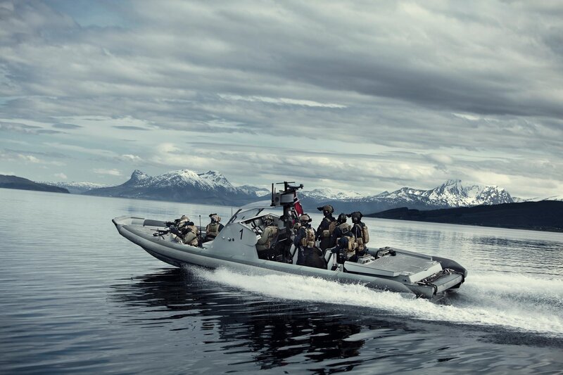 Military boat in mountainous waters