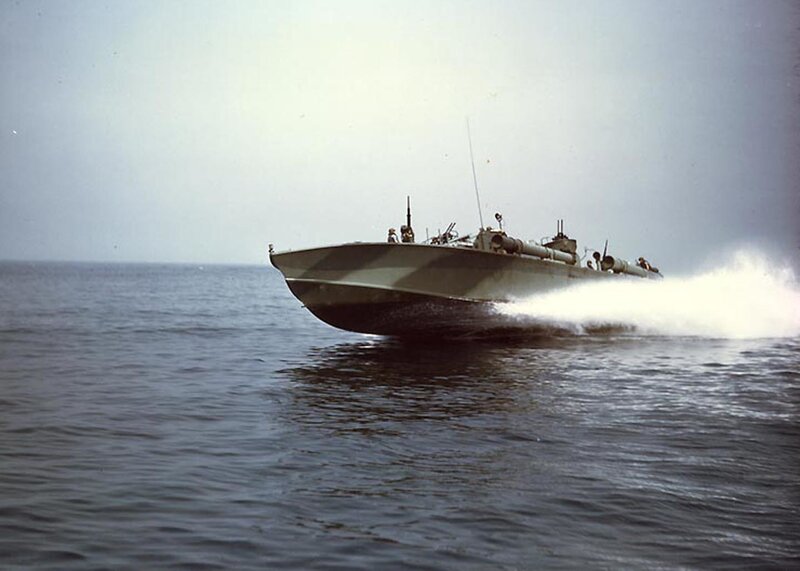 Military boat speeding on water