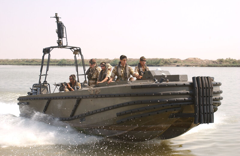Military boat with soldiers on river