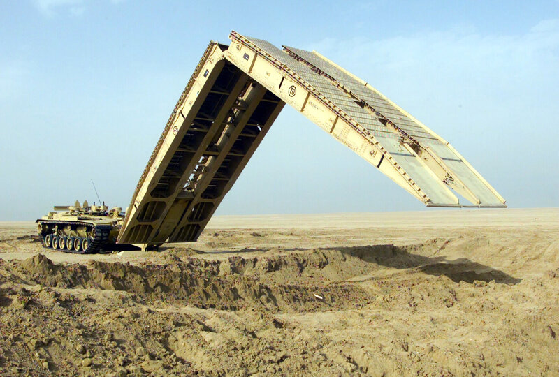 Military bridge deployment in desert