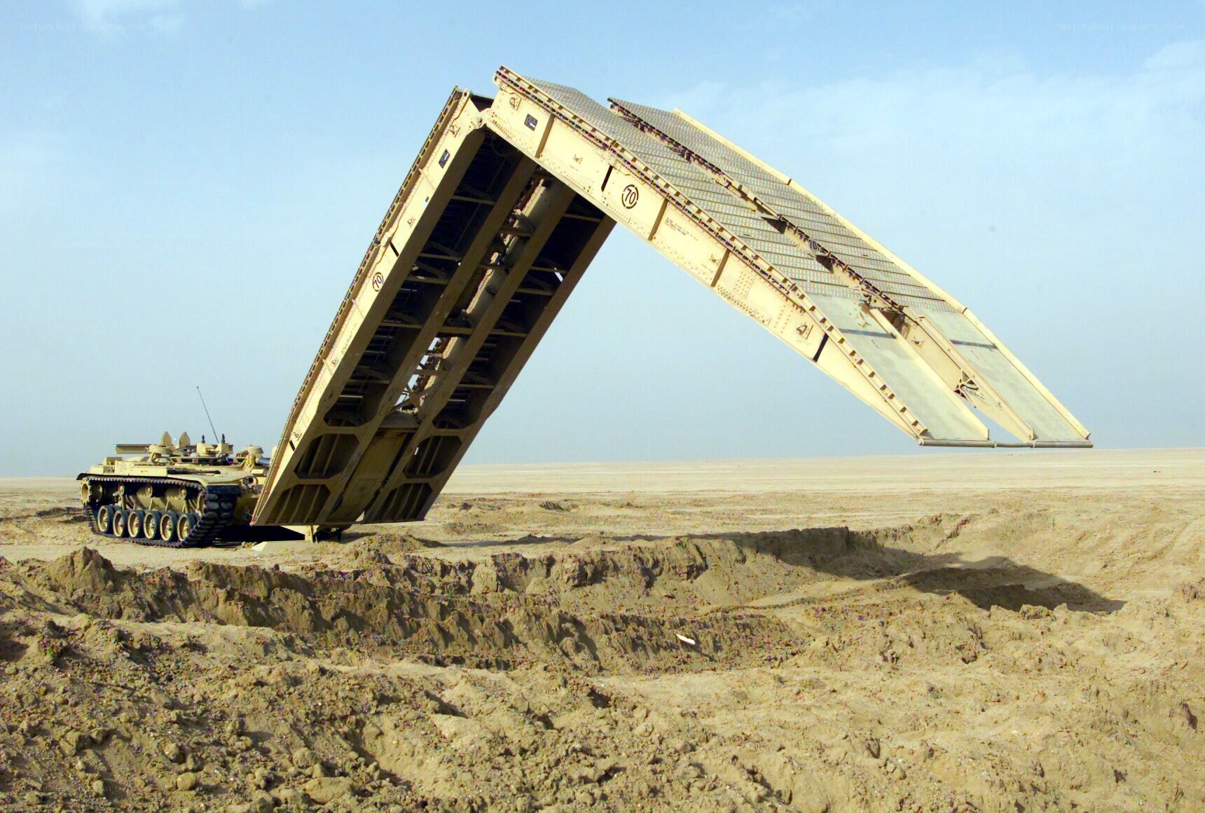 Military bridge deployment in desert