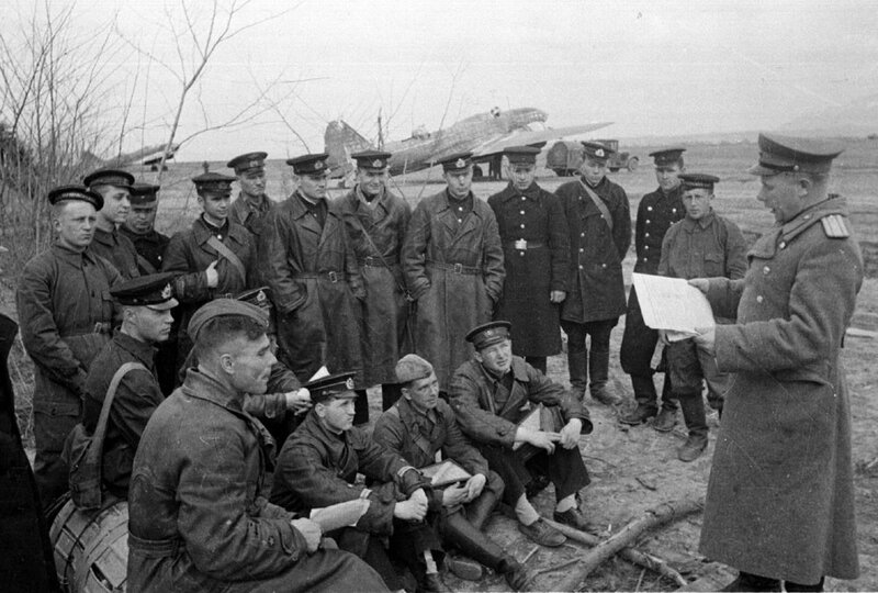 Military briefing near aircraft