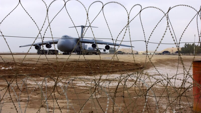Military Cargo Plane — Gray, Dramatic, Photograph, Barbed Wire