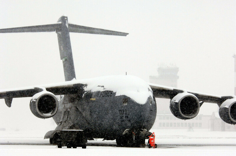 Military cargo plane in snowstorm