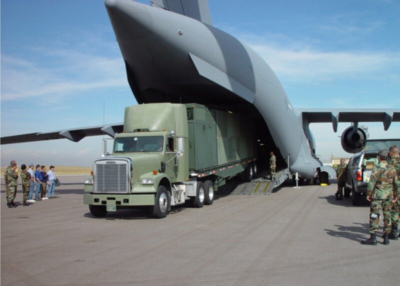 Military cargo plane loading truck