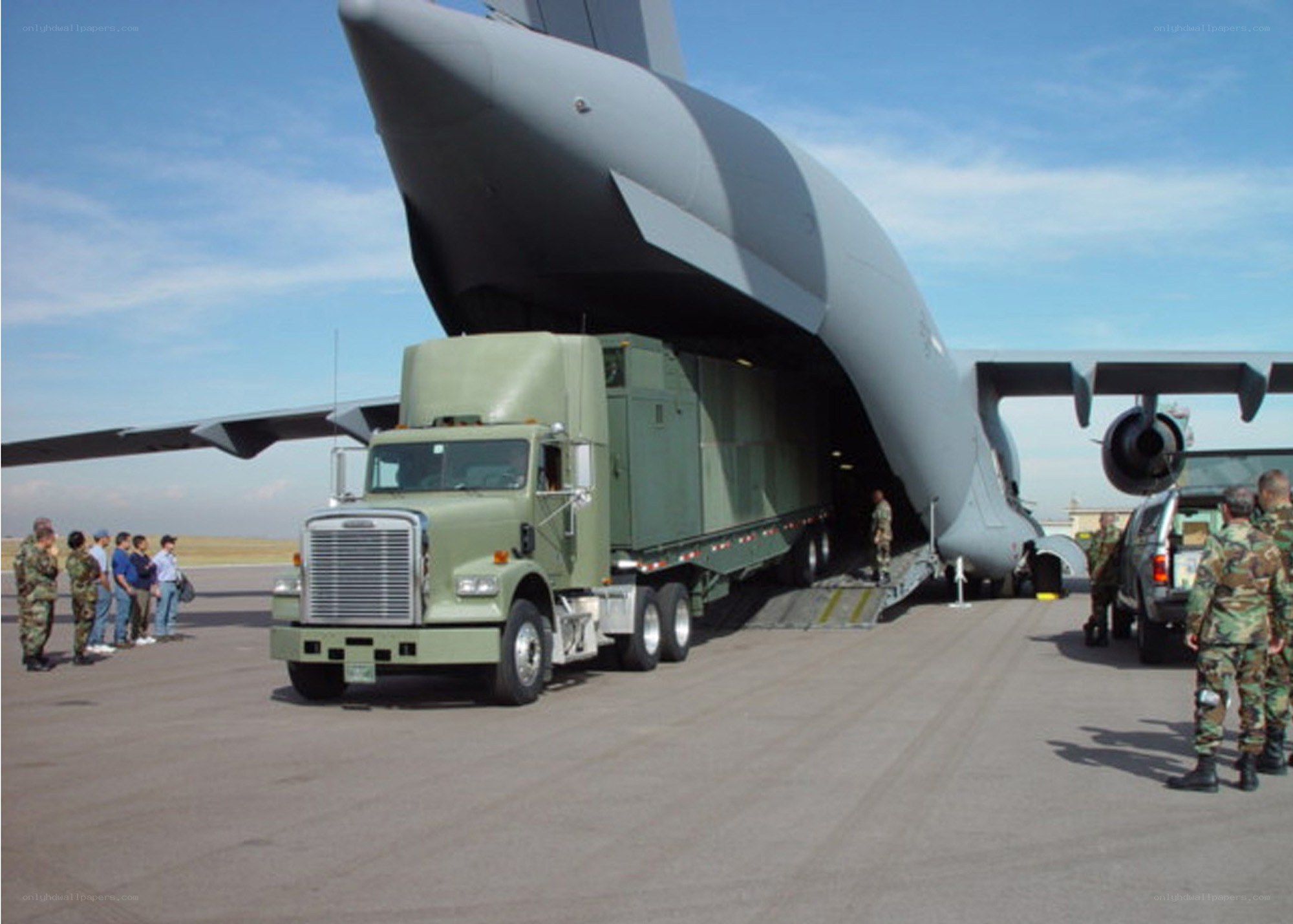 Military cargo plane loading truck