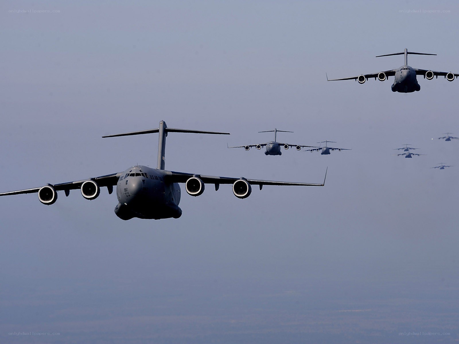 Military cargo planes in formation