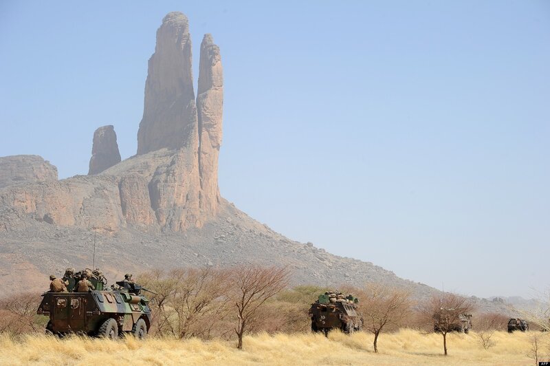 Military convoy in desert landscape