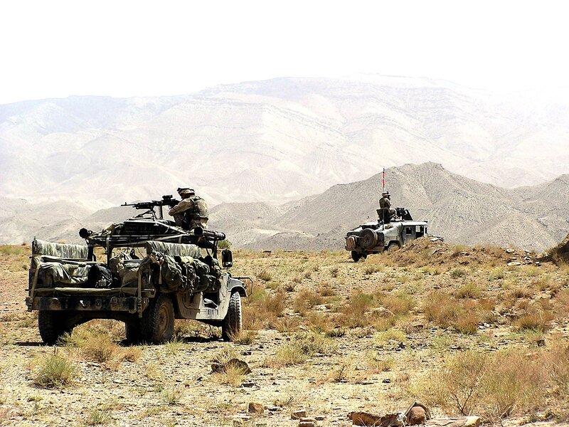 Military convoy in desert terrain