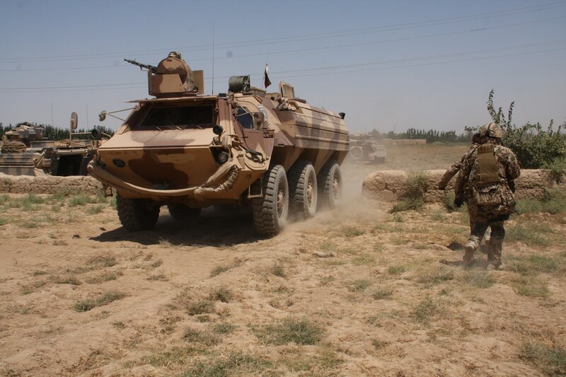 Military convoy in desert terrain