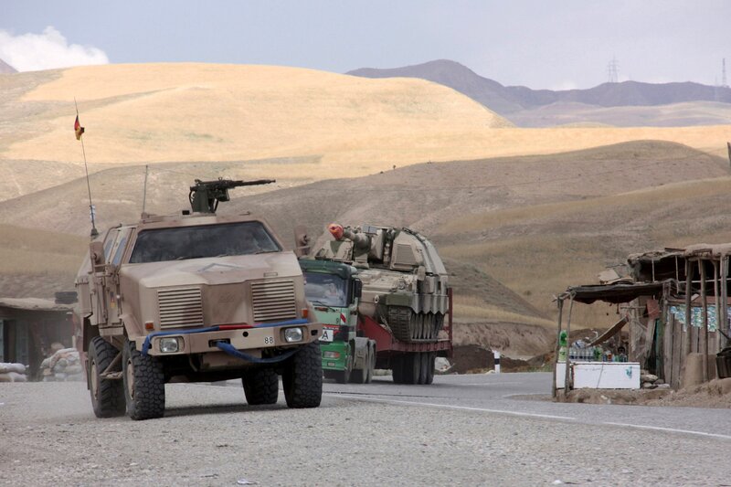 Military convoy in desert terrain