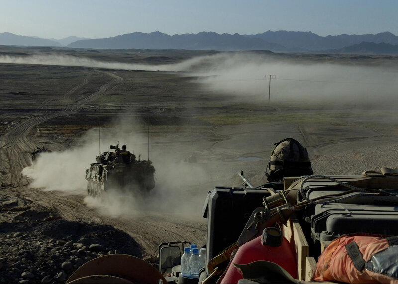 Military convoy in desert terrain