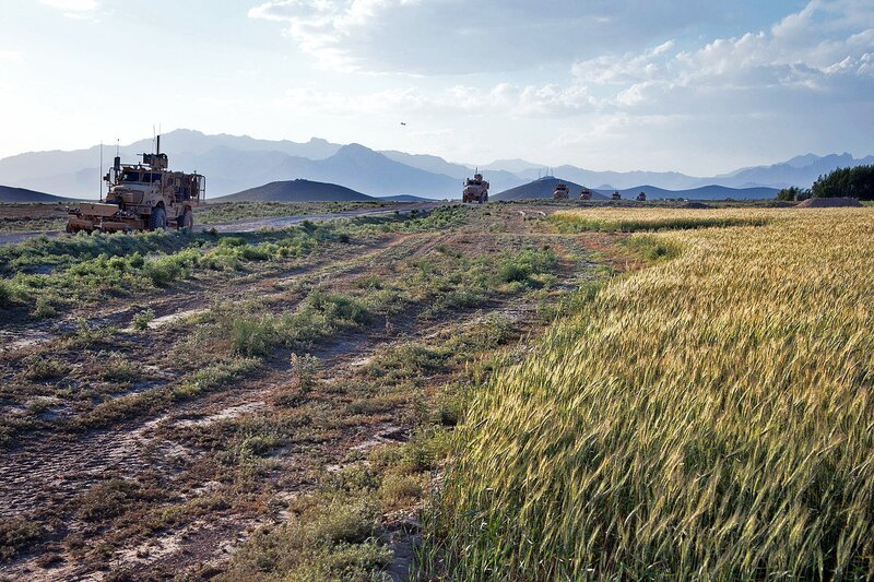 Military convoy in rural landscape