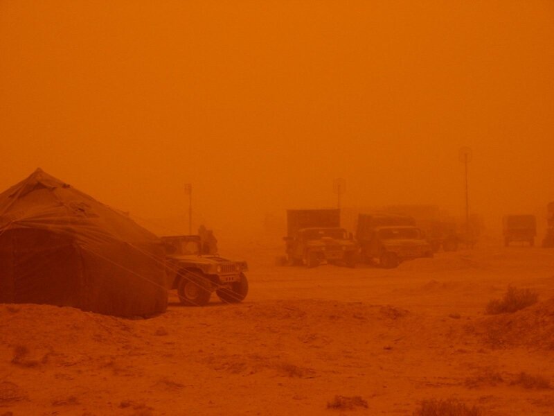 Military convoy in sandstorm