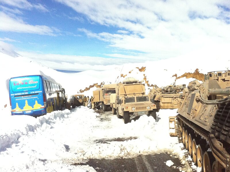 Military convoy in snowy mountains