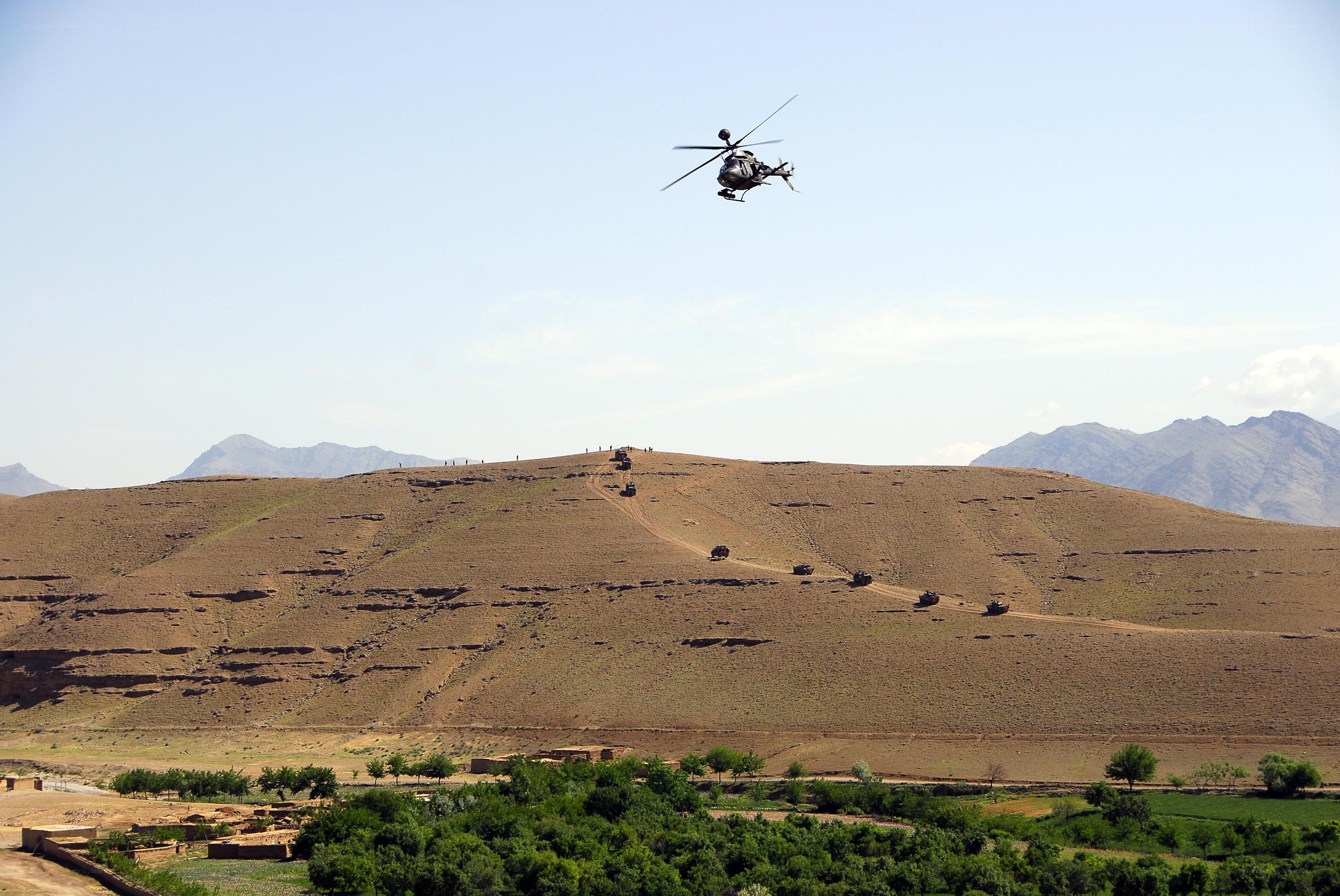 Military convoy on a hillside