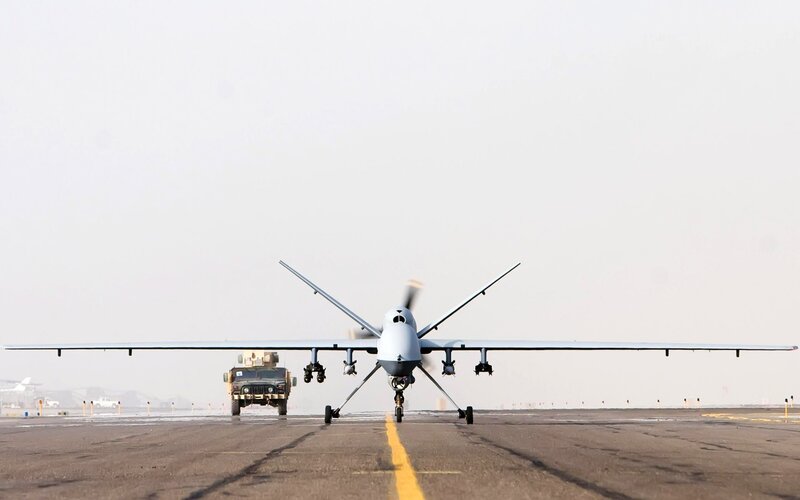 Military Drone on Runway — Gray, Neutral, Morning
