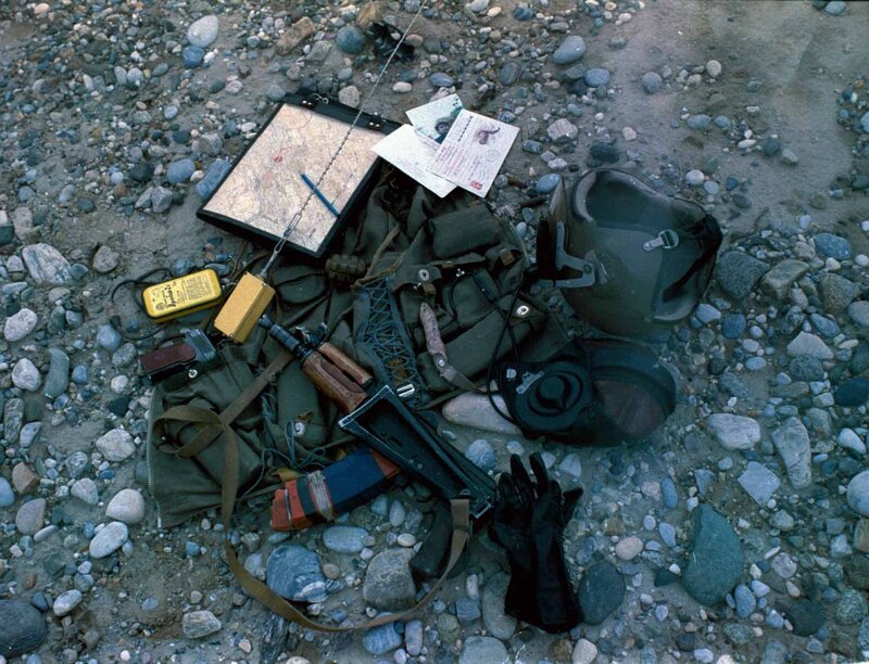 Military gear scattered on ground