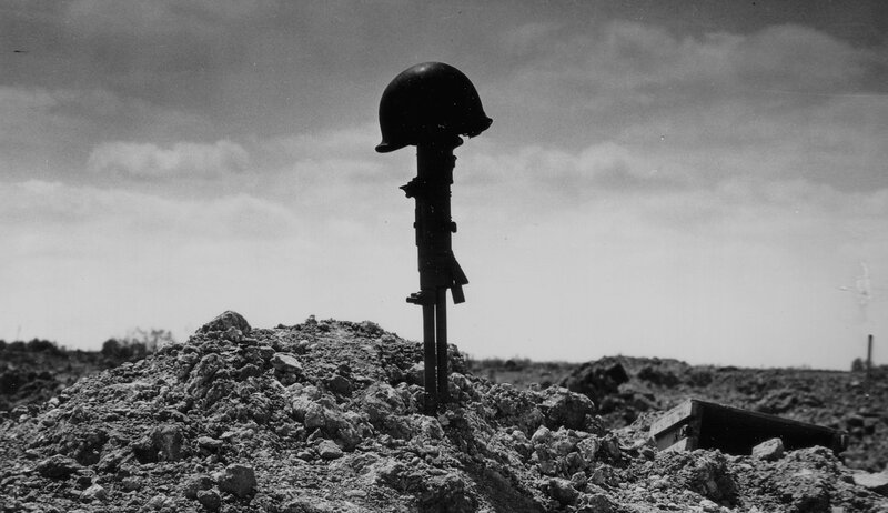 Military grave marker on battlefield