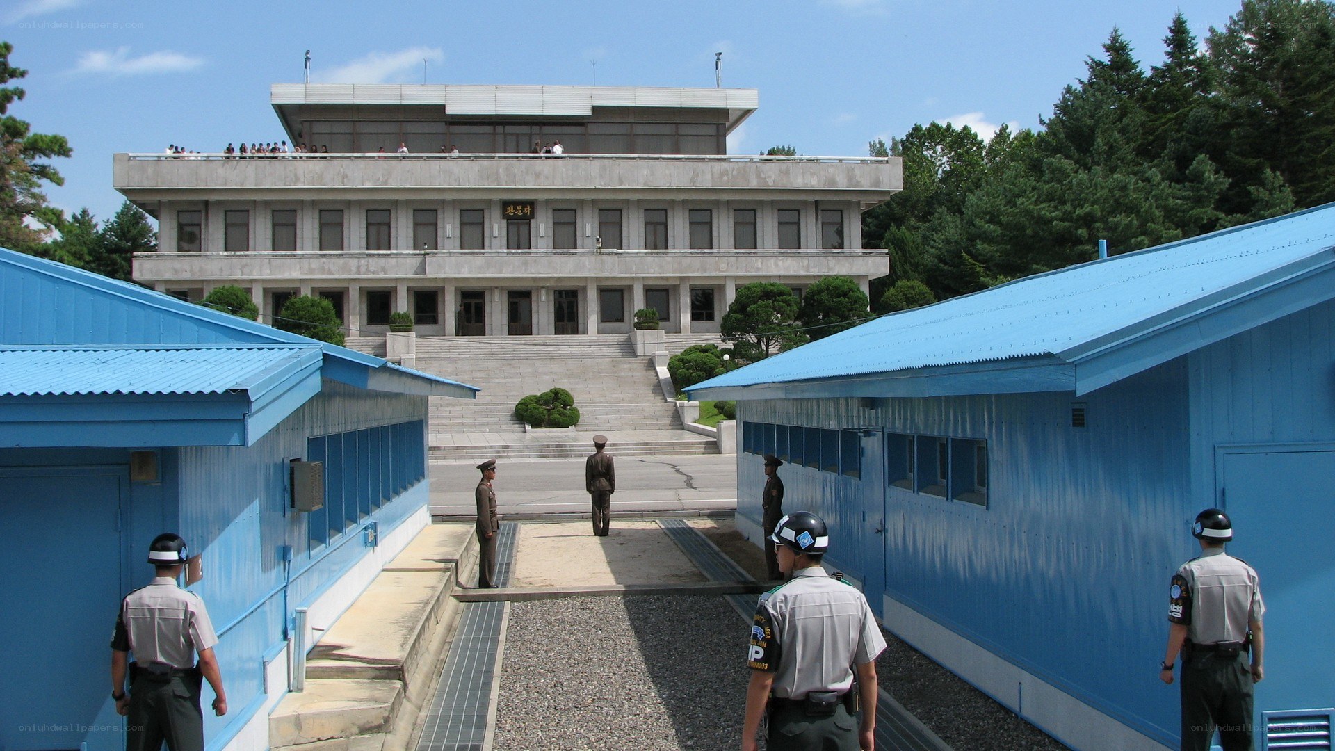 Military guards at border building
