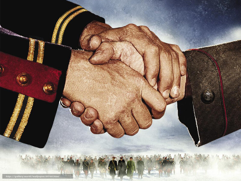 Military handshake over soldiers