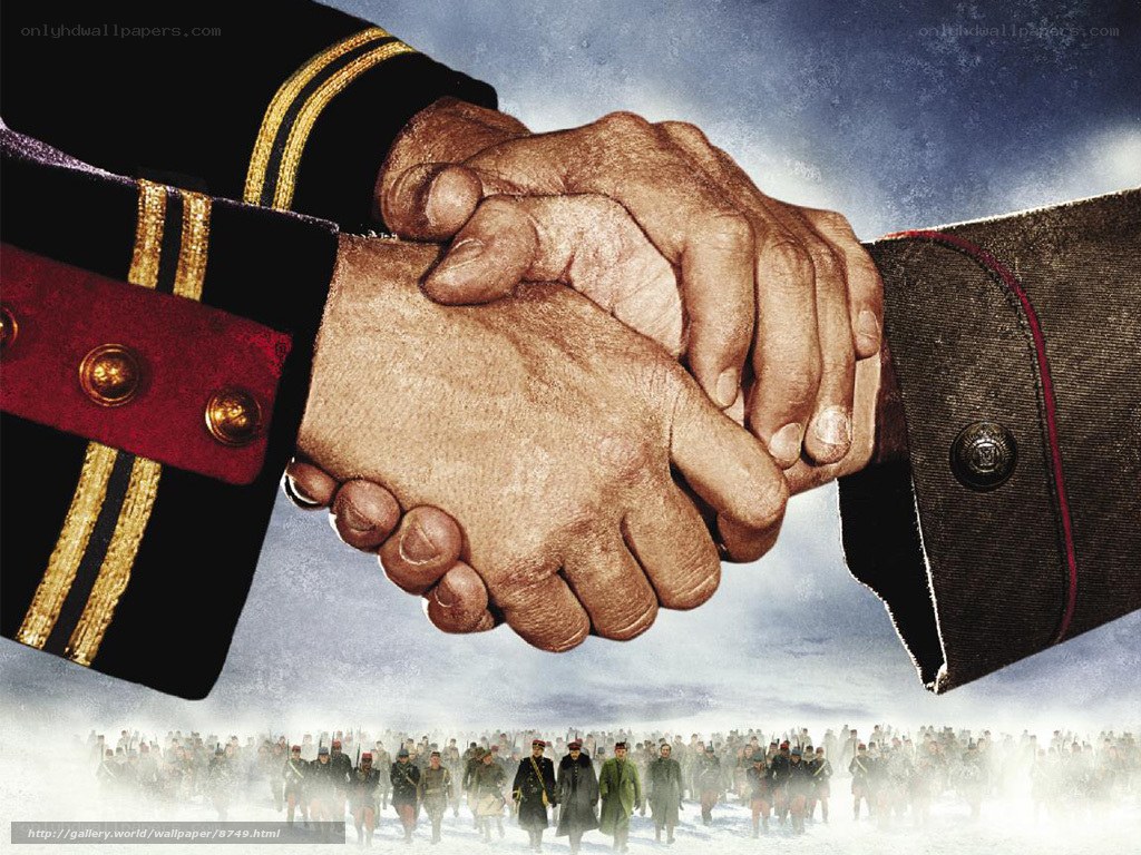 Military handshake over soldiers