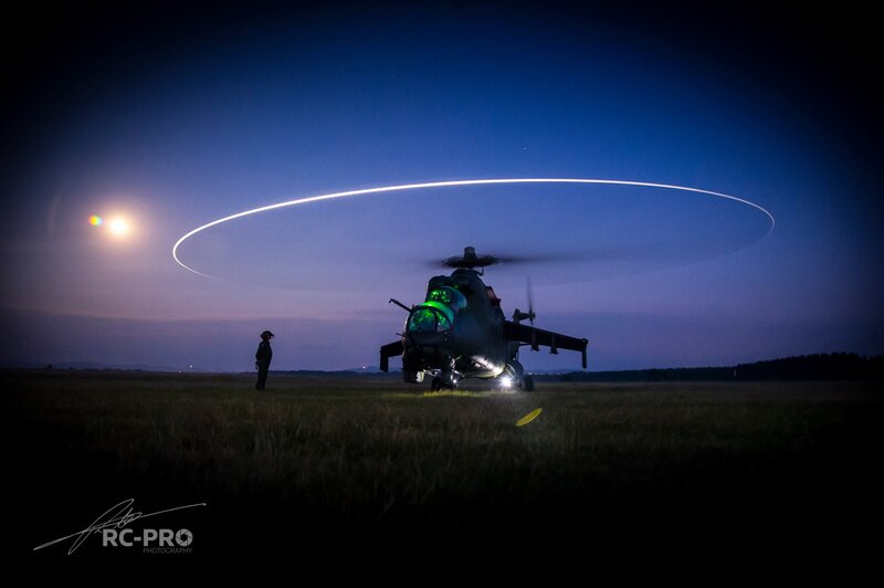 Military Helicopter at Night — Blue