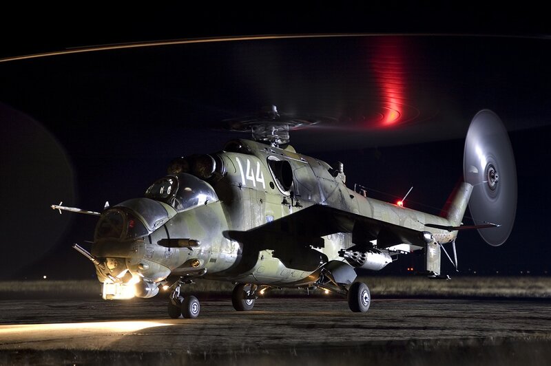 Military Helicopter at Night — Green, Dramatic, Photograph, Rotor Blades