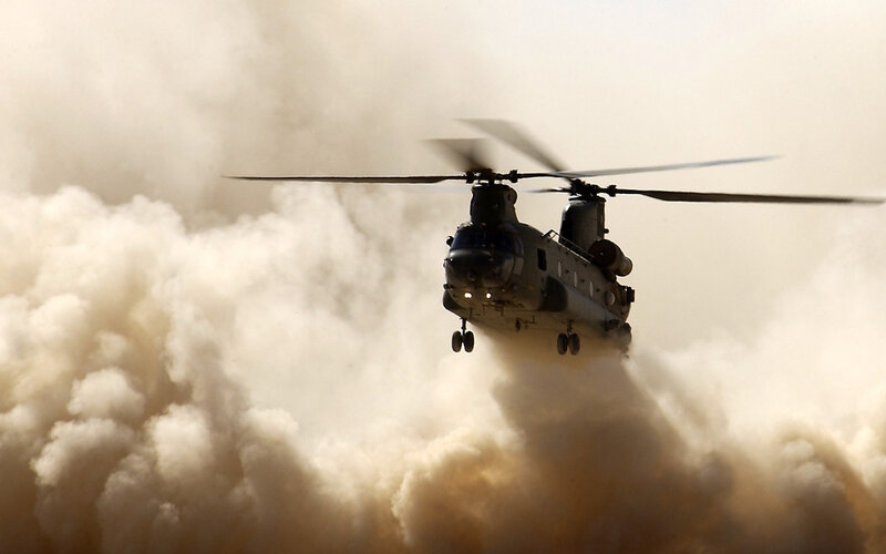 Military Helicopter in Dust