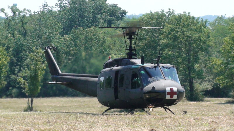 Military helicopter in field
