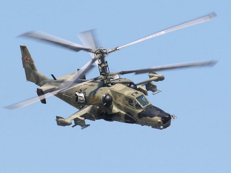 military helicopter in flight