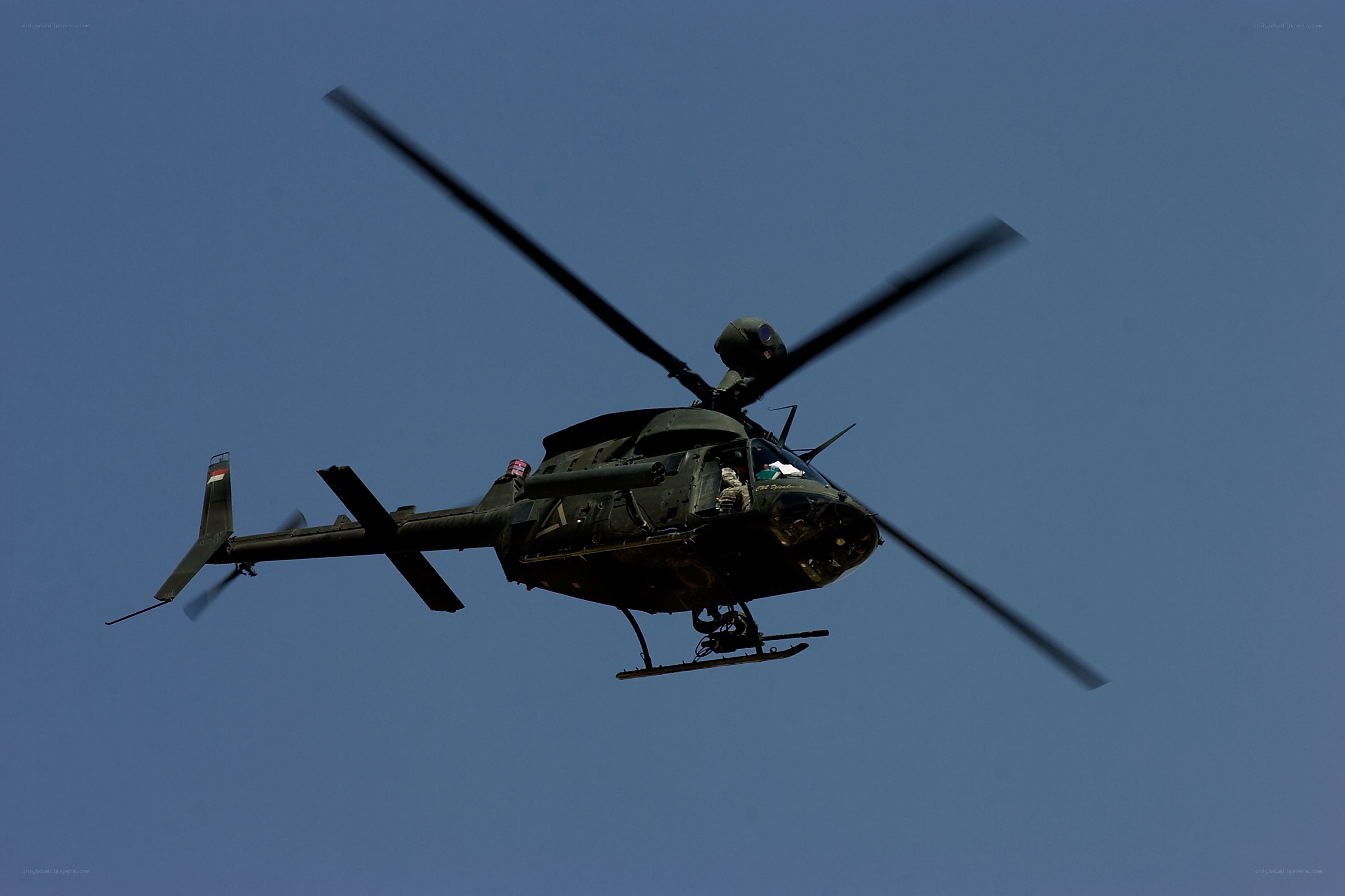 military helicopter in flight