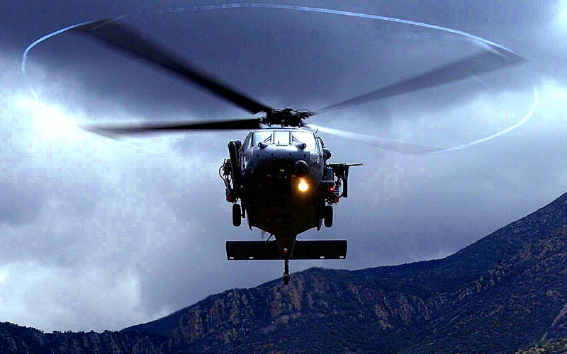 military helicopter in flight