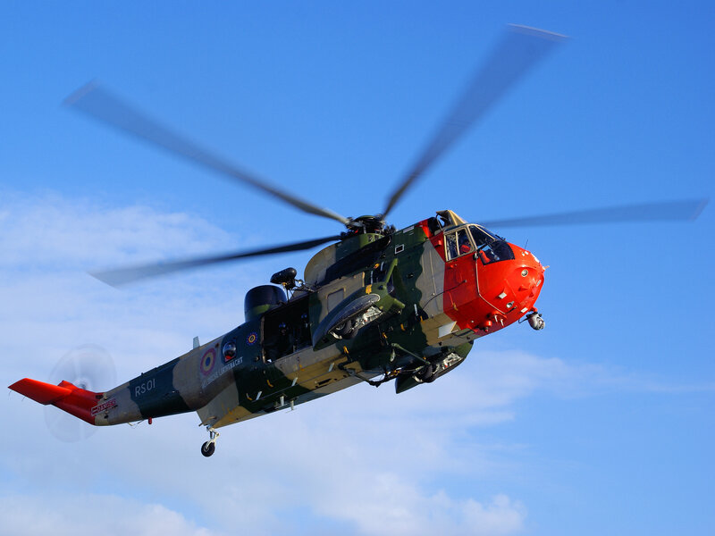 military helicopter in flight