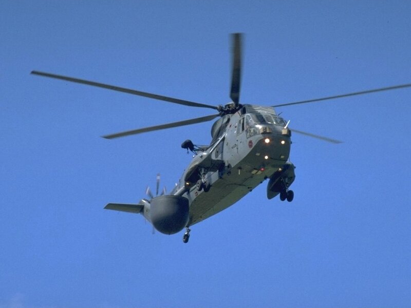 military helicopter in flight