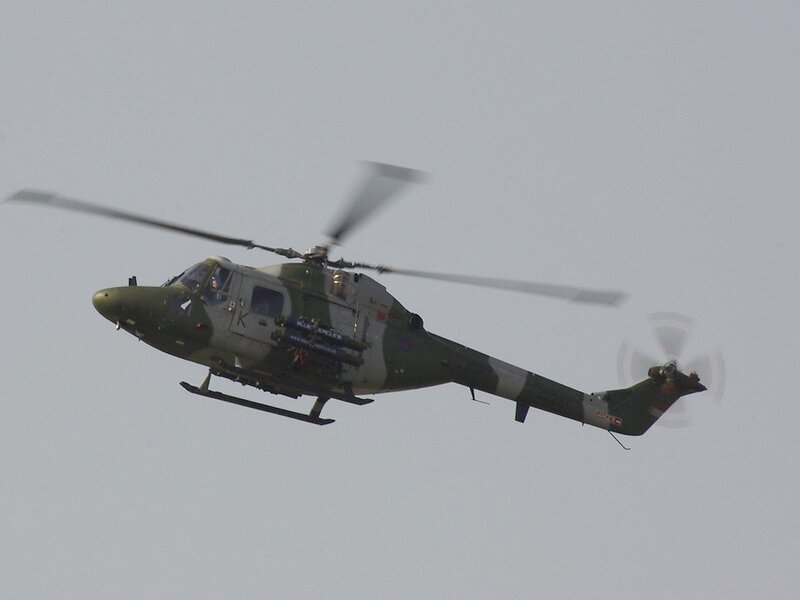 military helicopter in flight