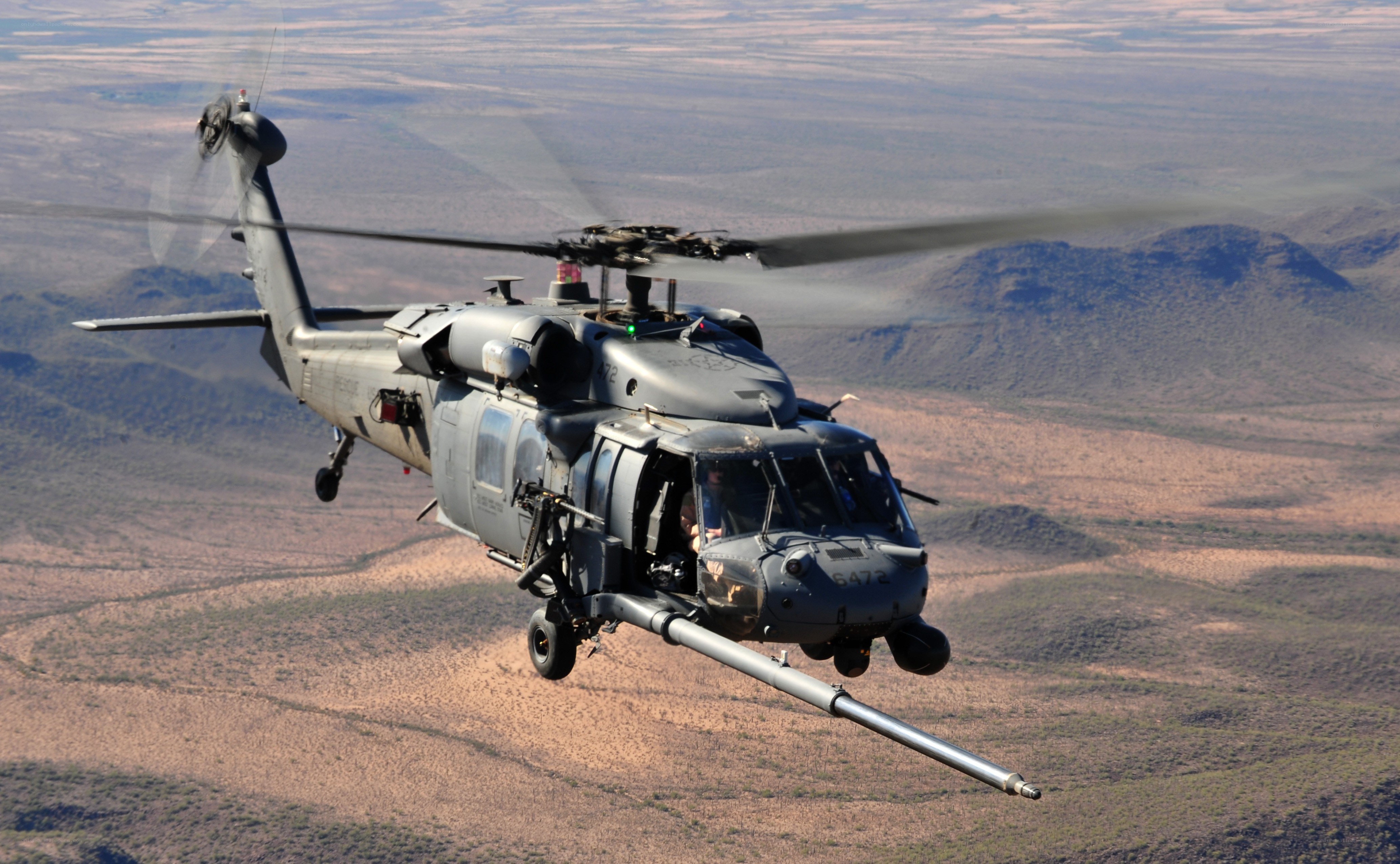 military helicopter in flight