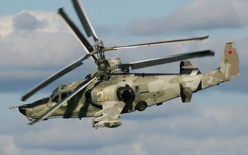 military helicopter in flight