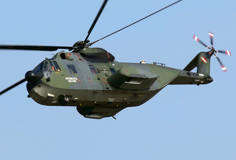 military helicopter in flight