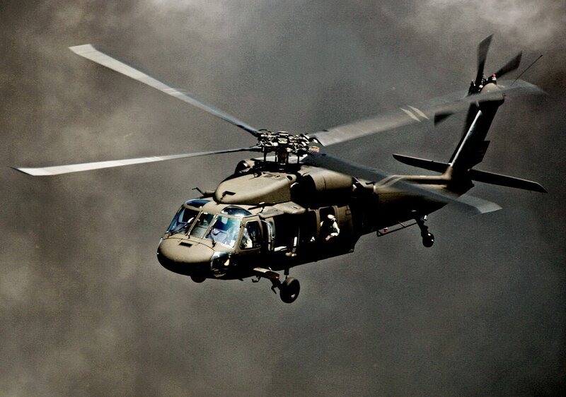 military helicopter in flight