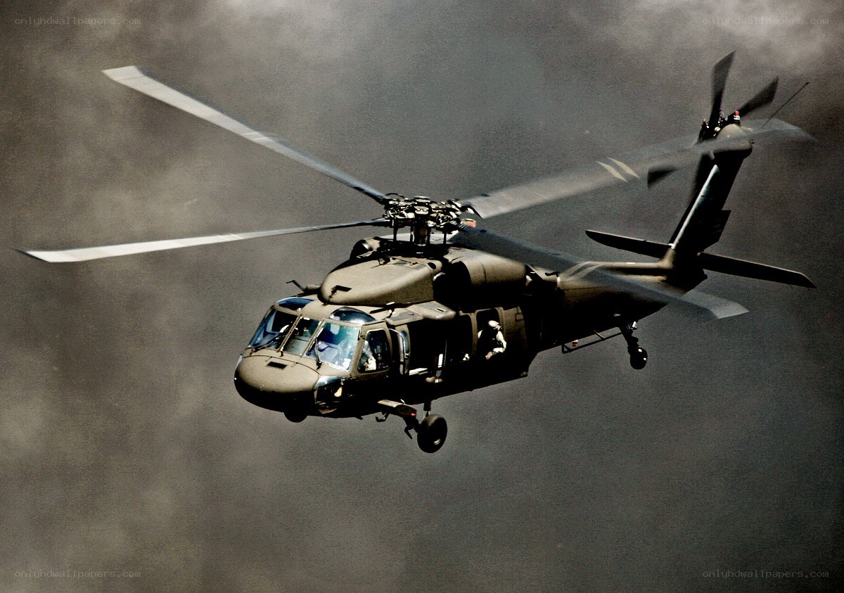 military helicopter in flight
