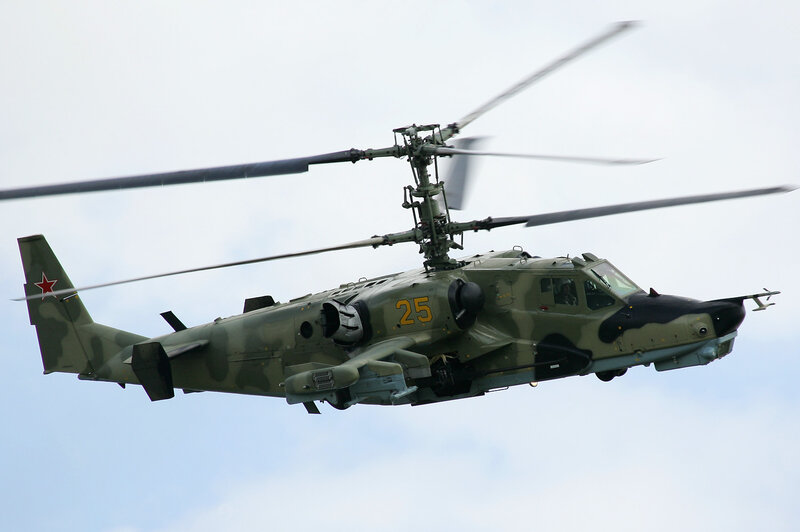 military helicopter in flight